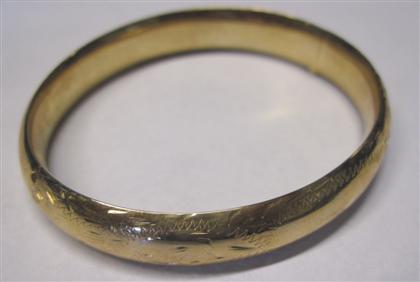 Appraisal: Yellow gold filled bangle braceletHinged bangle etched on front