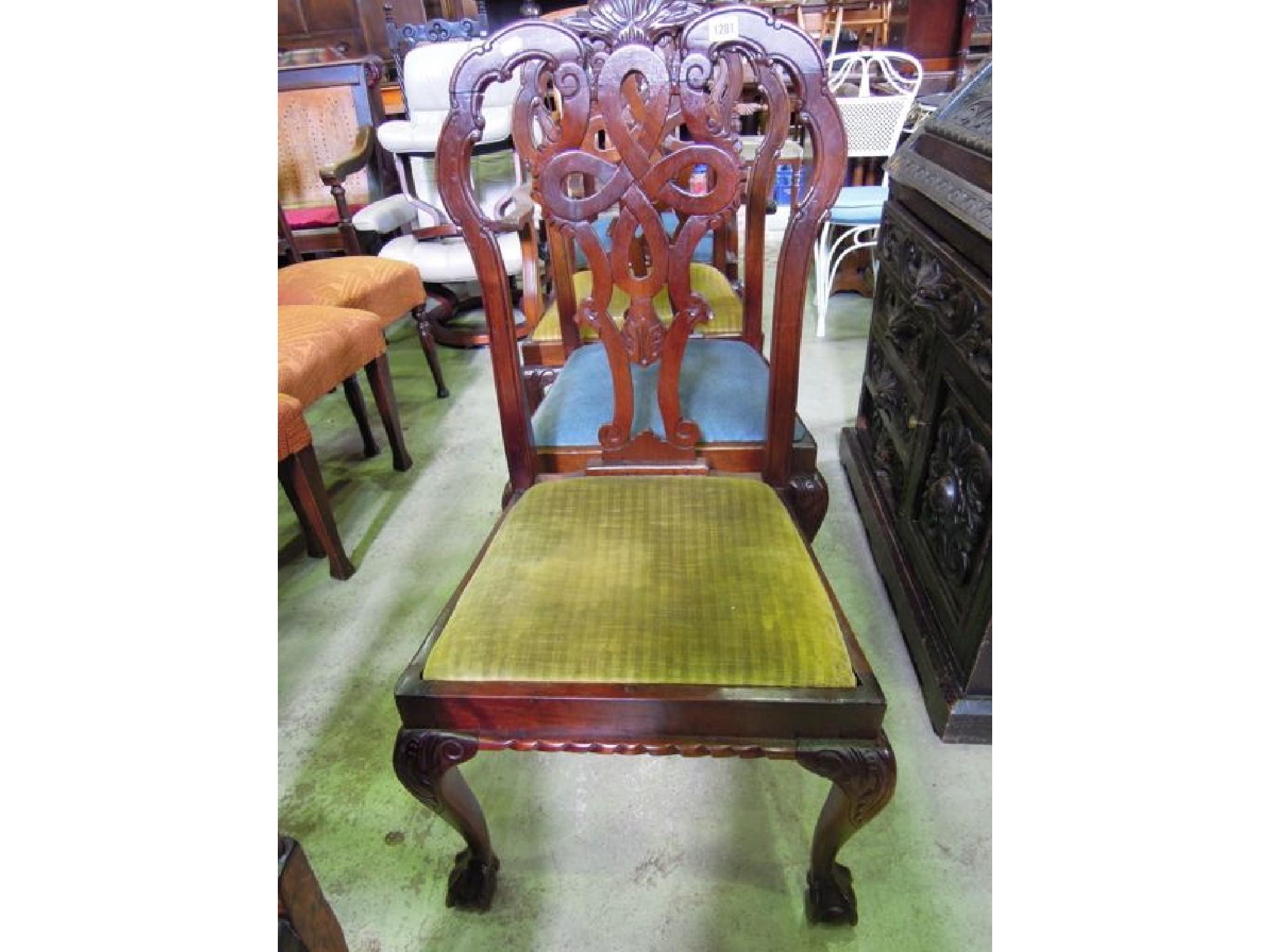 Appraisal: A set of four mahogany dining chairs in the Chippendale