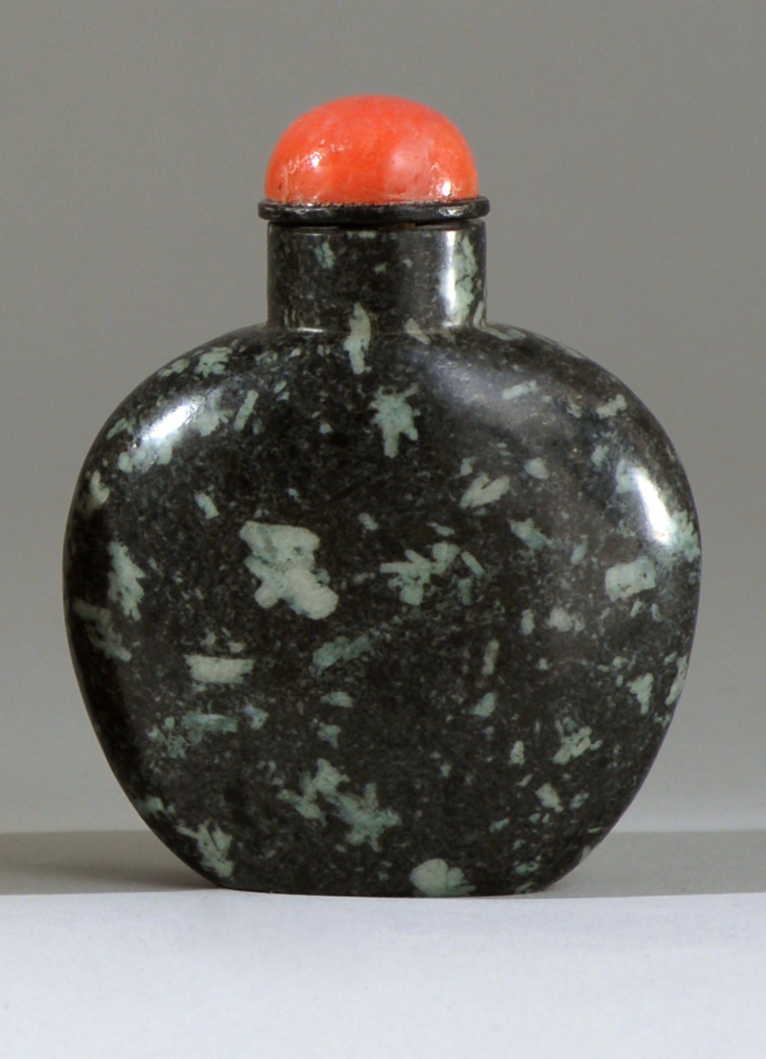 Appraisal: BLACK AND WHITE SANDSTONE SNUFF BOTTLE Late th CenturyIn flattened