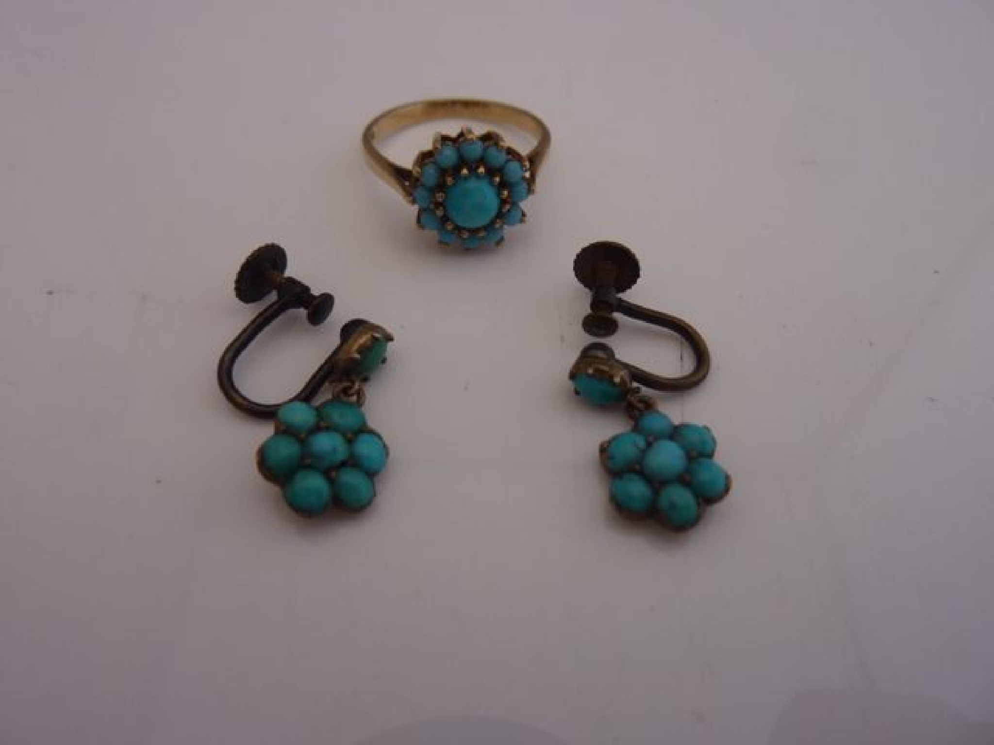 Appraisal: A pair of turquoise flower head cluster earrings with screw