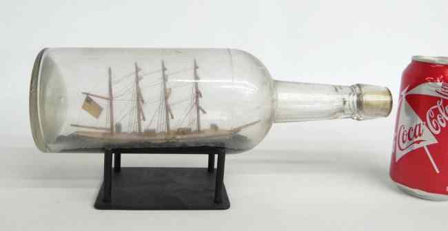 Appraisal: C New England ship in bottle with American flag ''