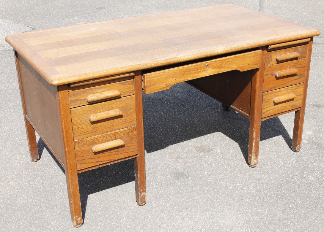 Appraisal: A 's oak desk the over hanging top with a