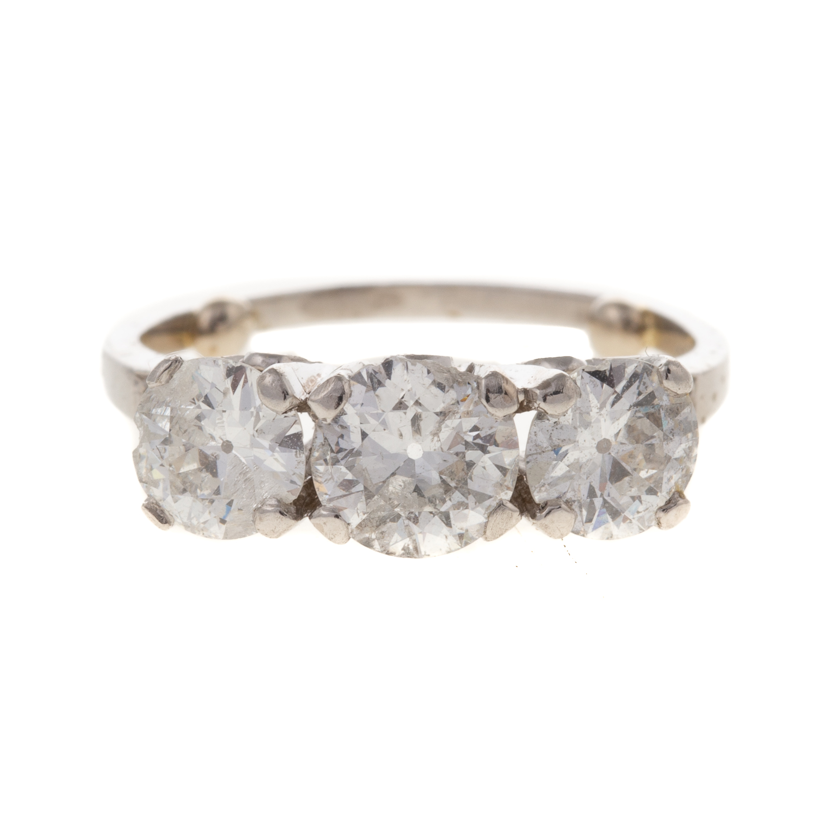 Appraisal: A CTW THREE-STONE DIAMOND BAND IN PLATINUM Platinum band featuring