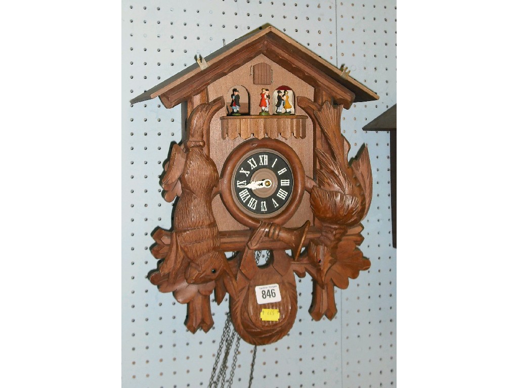 Appraisal: Contemporary Black Forest cuckoo clock the black dial within a