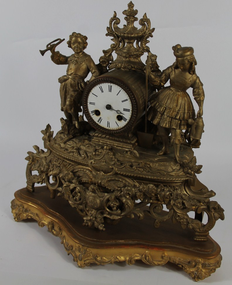 Appraisal: A thC French gilt spelter mantel clock with figures either