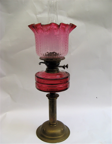 Appraisal: CRANBERRY GLASS AND BRASS KEROSENE TABLE LAMP English Victorian c