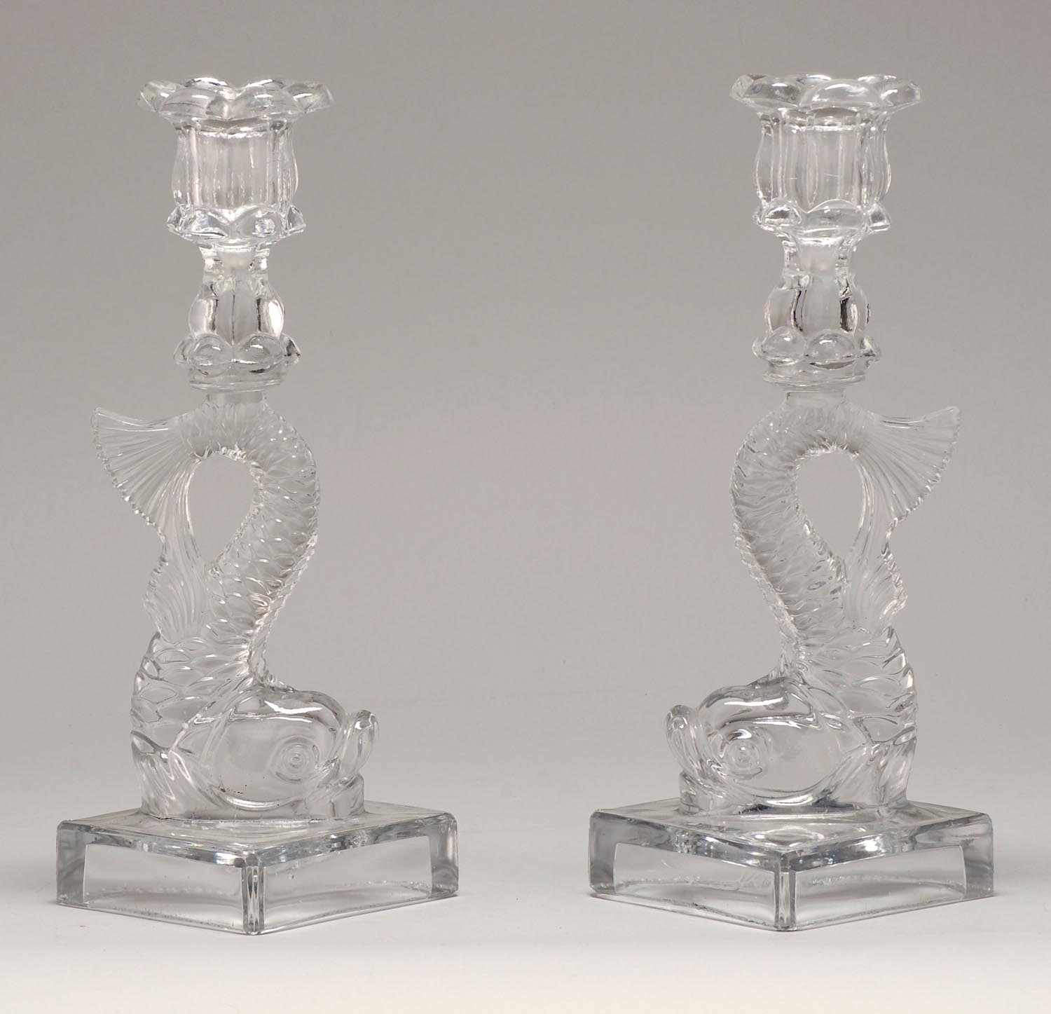 Appraisal: PAIR OF ANTIQUE SANDWICH PRESSED GLASS CANDLESTICKS in dolphin form