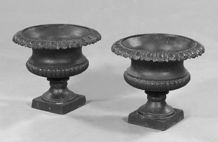 Appraisal: Pair of Cast-Iron Garden Urns-on-Pedestals each with a gadroon modeled