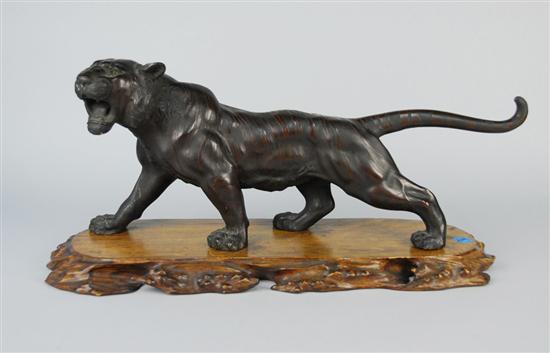 Appraisal: JAPANESE FIGURE OF A TIGER on a carved wood base