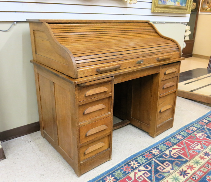 Appraisal: AN OAK ROLL-TOP DESK American c a double pedestal S-roll