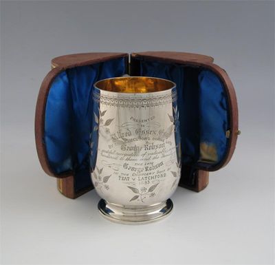 Appraisal: A Victorian engraved mug with presentation inscription gilt interior and