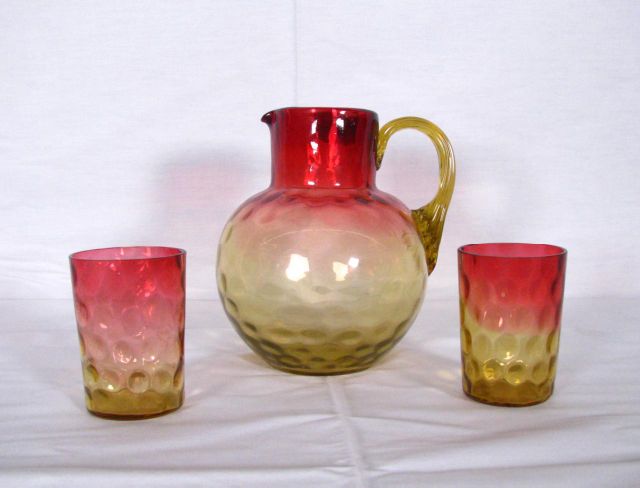 Appraisal: Thumbprint Amberina pitcher and glasses inch pitcher with applied handle