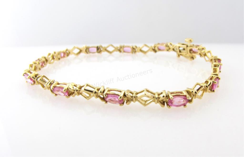 Appraisal: A K yellow gold tennis style bracelet with twelve oval