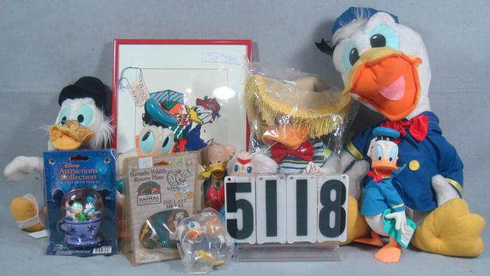 Appraisal: Donald Duck items plush pictures figurines coin bank puzzel bubble