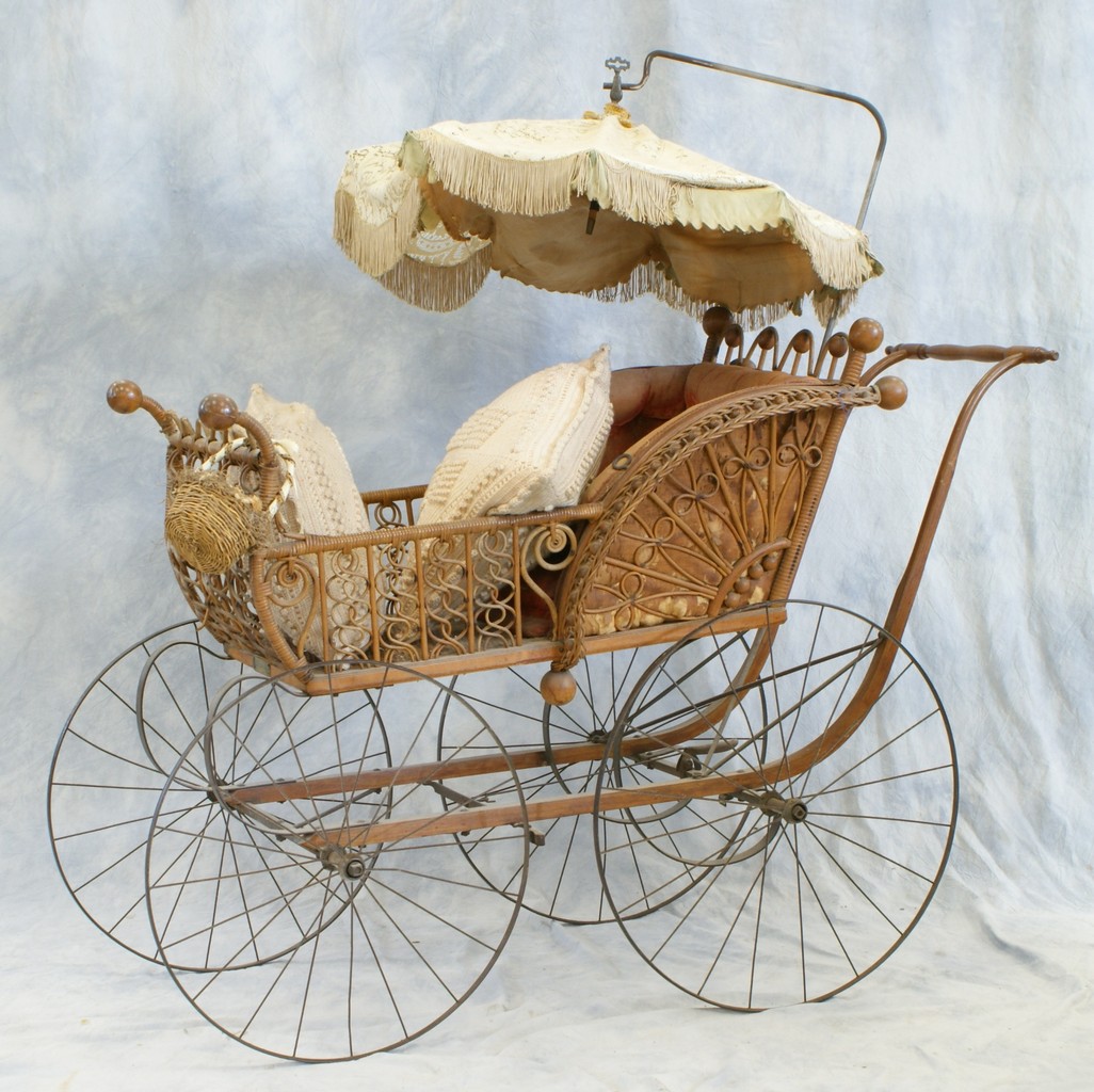 Appraisal: Wicker Baby Carriage steel wheels parasol top with steel suspension