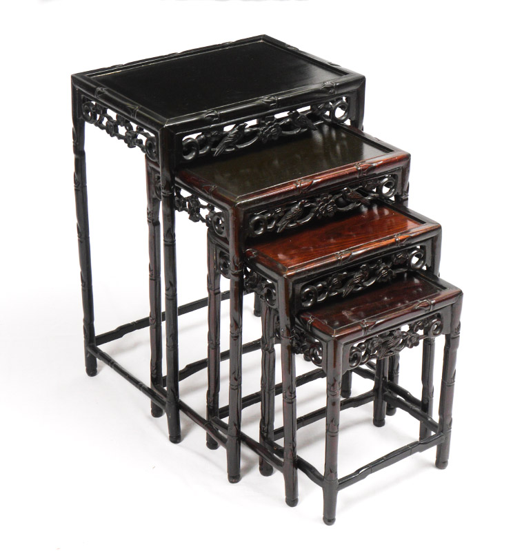 Appraisal: NEST OF CARVED CHINESE TABLES Ebonized finish each with carved