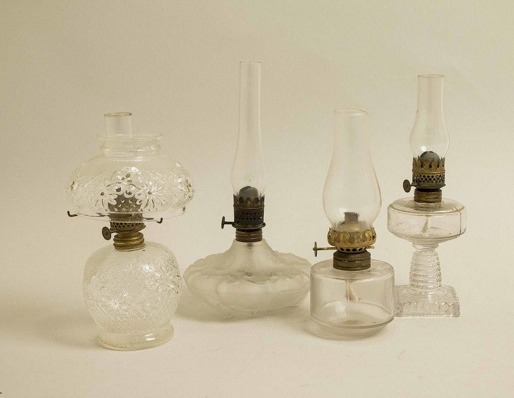 Appraisal: Four Assorted Oil Lamps Four assorted glass frosted and clear