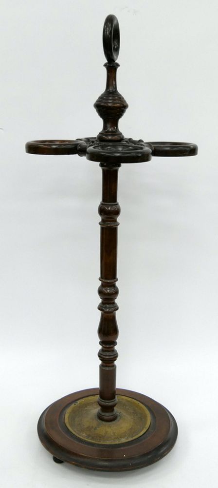 Appraisal: ANTIQUE CARVED WOODEN UMBRELLA CANE STAND Measures tall with round