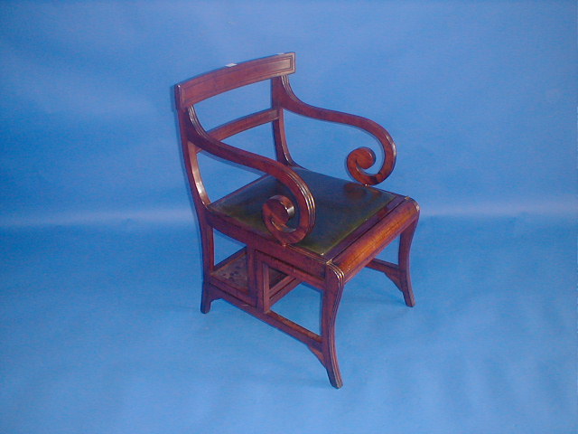 Appraisal: A Regency style mahogany folding scroll armchair steps