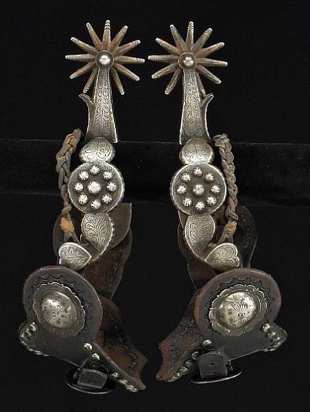 Appraisal: A pair of silver-mounted California style spurs signed Garcia Single