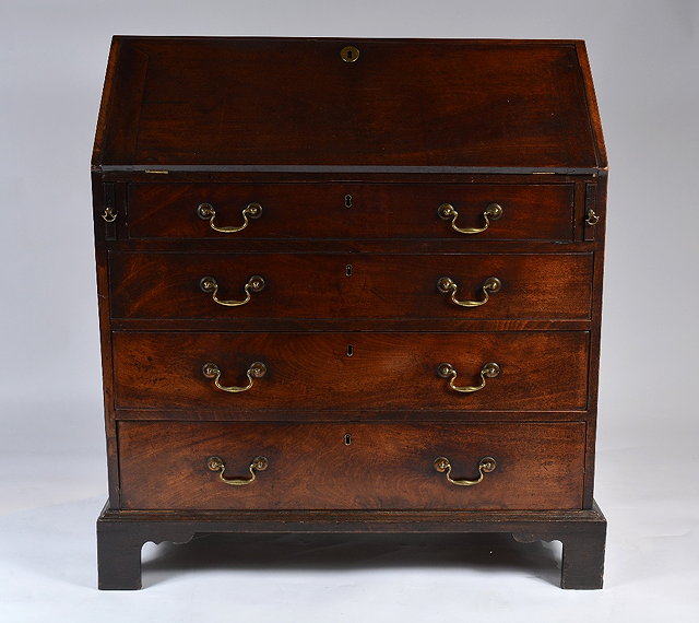 Appraisal: A George III mahogany bureauwith fall front fitted four drawers