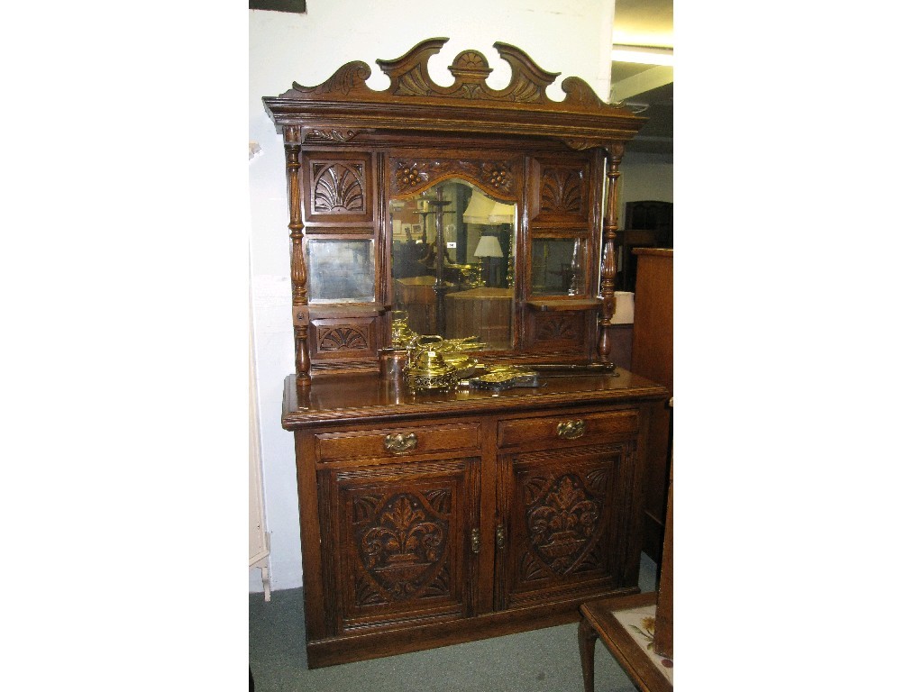 Appraisal: Carved oak mirror back sideboard