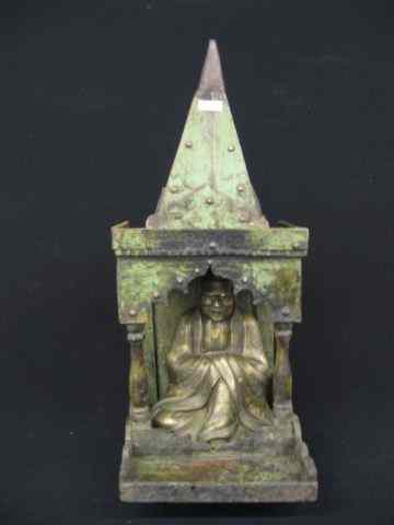 Appraisal: Oriental Bronze of a Seated god in Templestyle wooden holder