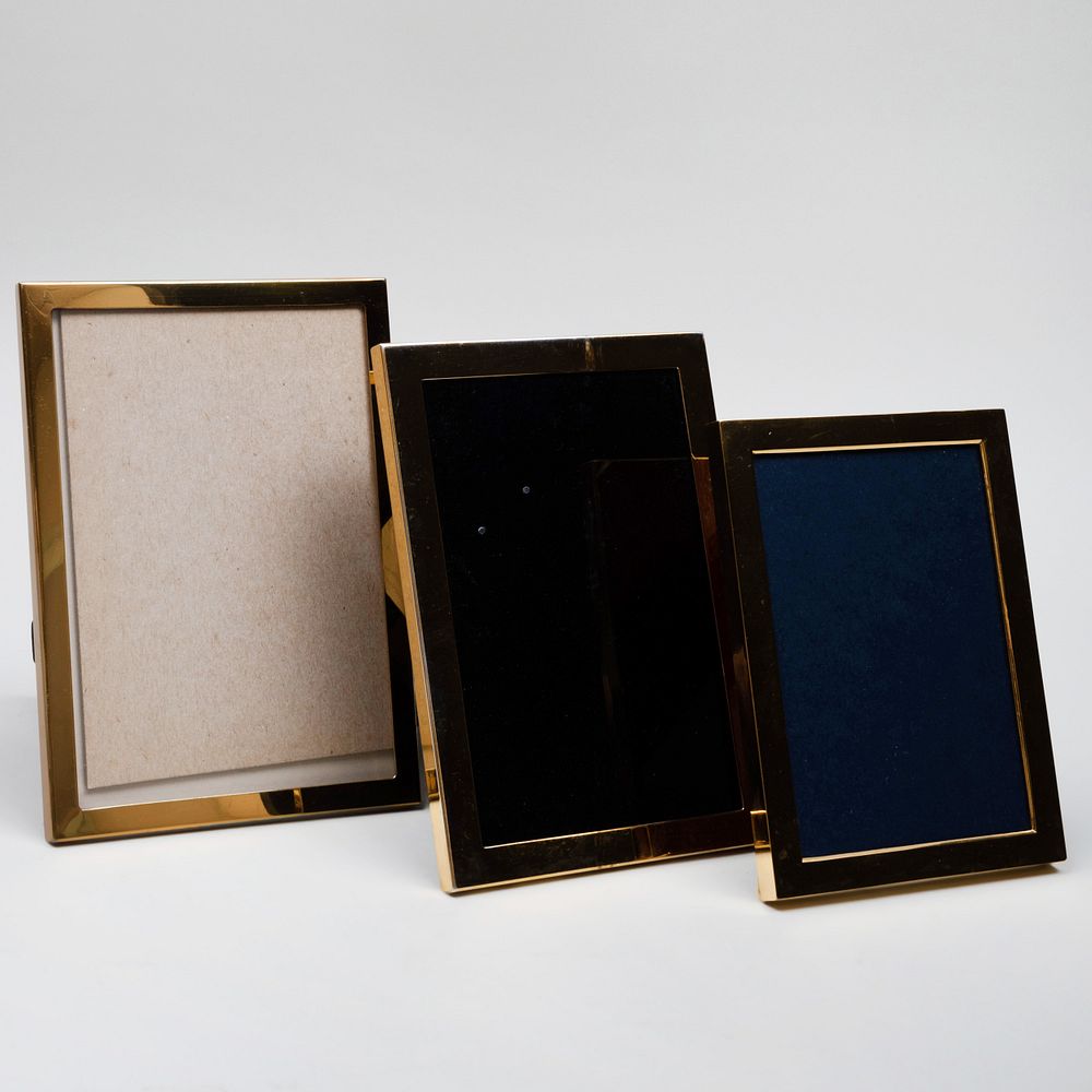 Appraisal: Two Silver-Gilt Picture Frames and a Brass Picture Frame Comprising