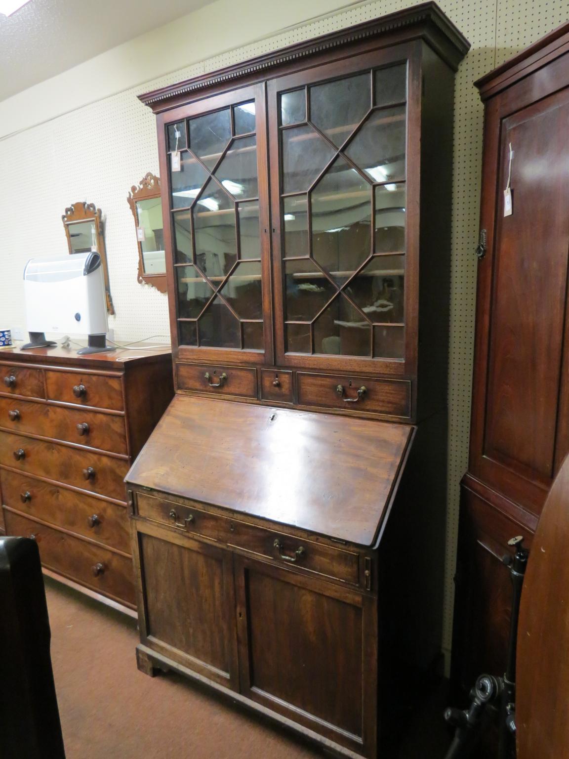 Appraisal: A Scottish George III mahogany bureau bookcase pair of thirteen-pane