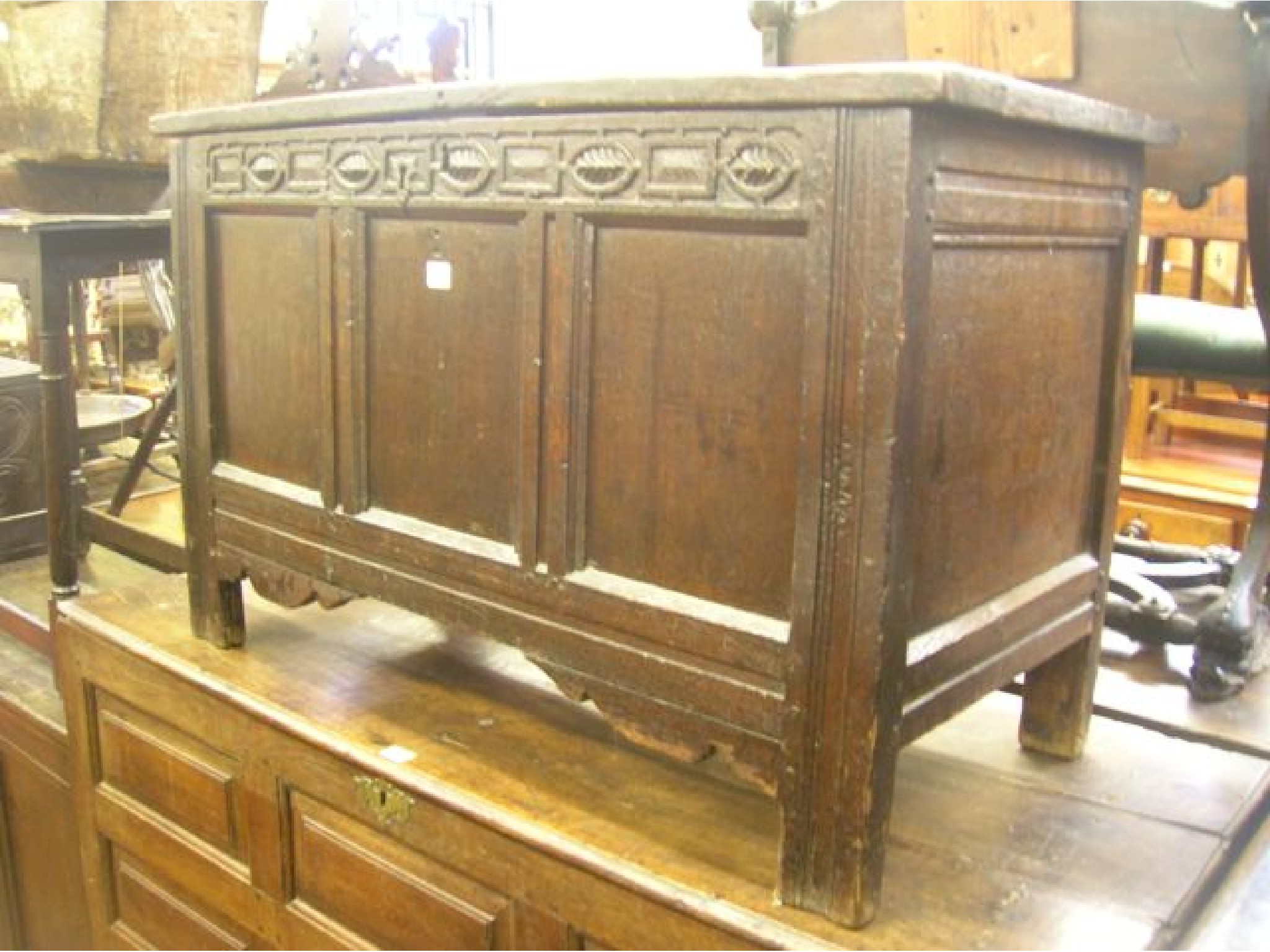 Appraisal: An early th century oak coffer with panelled framework and