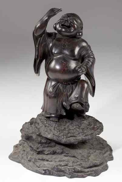 Appraisal: Chinese Bronze Lohanthe hollow cast figure in two parts atop