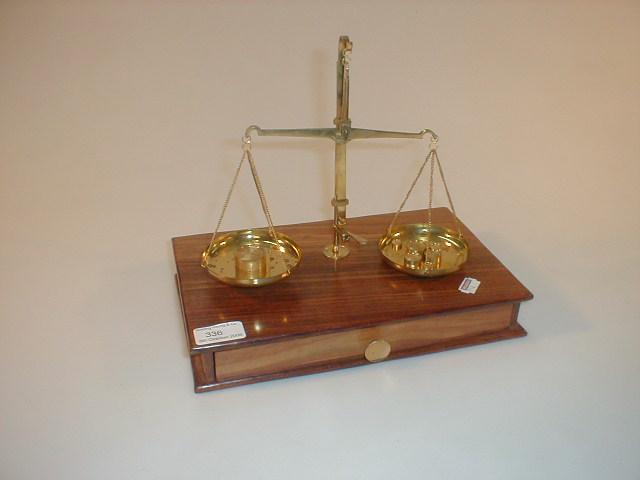 Appraisal: A set of brass balances contained with a set of