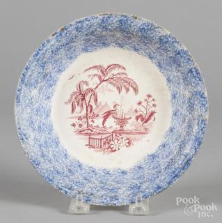 Appraisal: Blue spatter shallow bowl with red transfer decoration '' dia