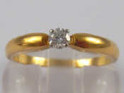 Appraisal: A French hallmarked carat gold diamond solitaire ring the round