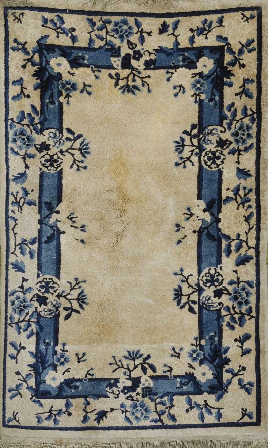 Appraisal: BLUE AND GOLD CHINESE RUG th CenturyIn a floral design