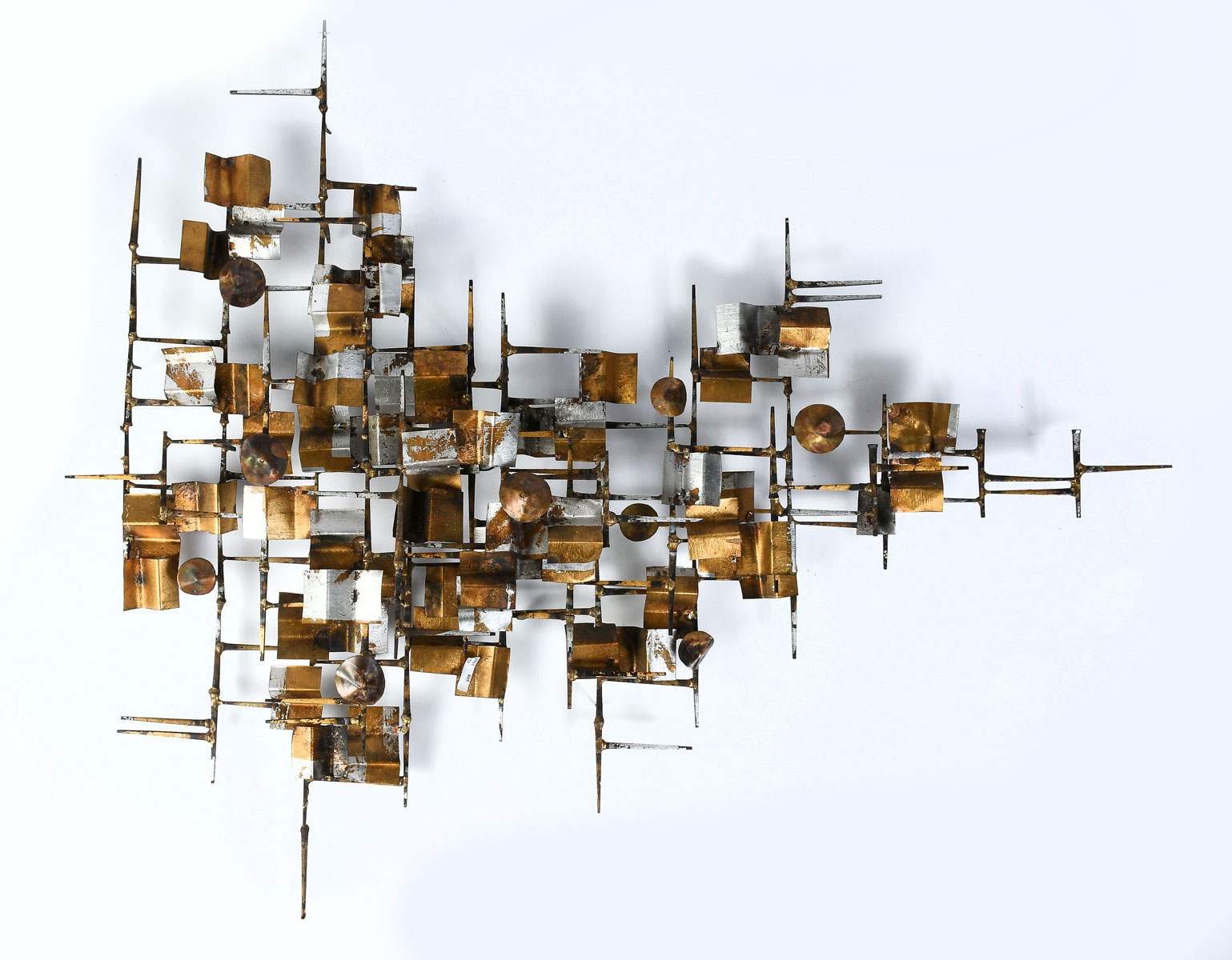 Appraisal: CURTIS JERE WALL SCULPTURE Circa Geometric brutalist floating forms on