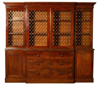 Appraisal: A Victorian mahogany breakfront press cupboard the upper doors now