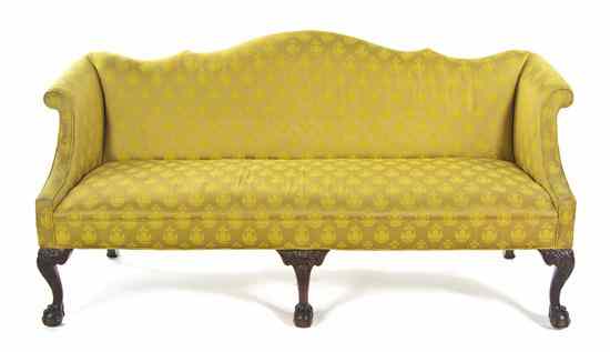 Appraisal: A Chippendale Style Camelback Settee having upholstered back sides and