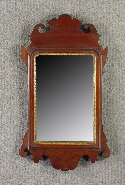 Appraisal: Walnut Chippendale Mirror Circa Typical carved crest ears and base