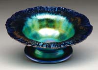 Appraisal: TIFFANY IRIDESCENT FOOTED BOWL Iridescent blue stretch glass with gold