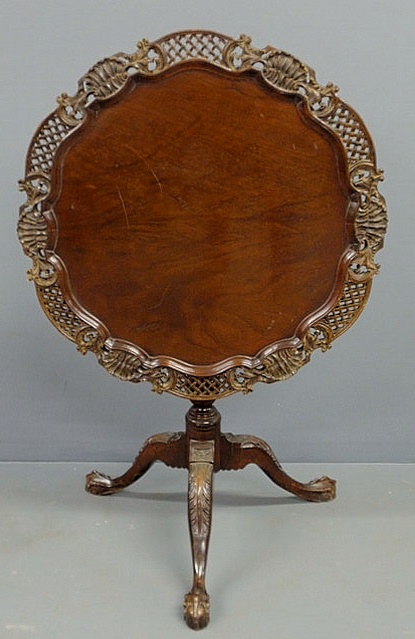 Appraisal: Chippendale style carved mahogany piecrust tea table with a birdcage