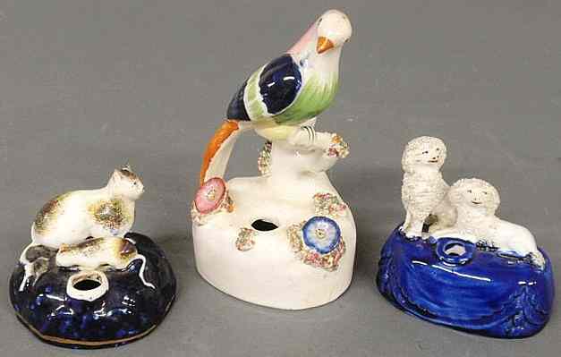 Appraisal: Three th c Staffordshire pen holders tallest h x w