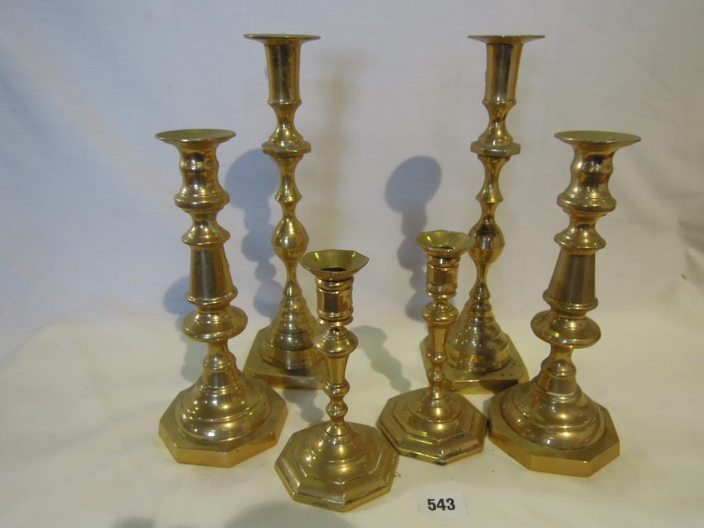 Appraisal: A collection of six matching brass candlesticks of graduating height