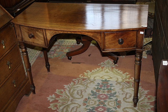 Appraisal: A TH CENTURY MAHOGANY BOW FRONT DRESSING TABLE fitted two