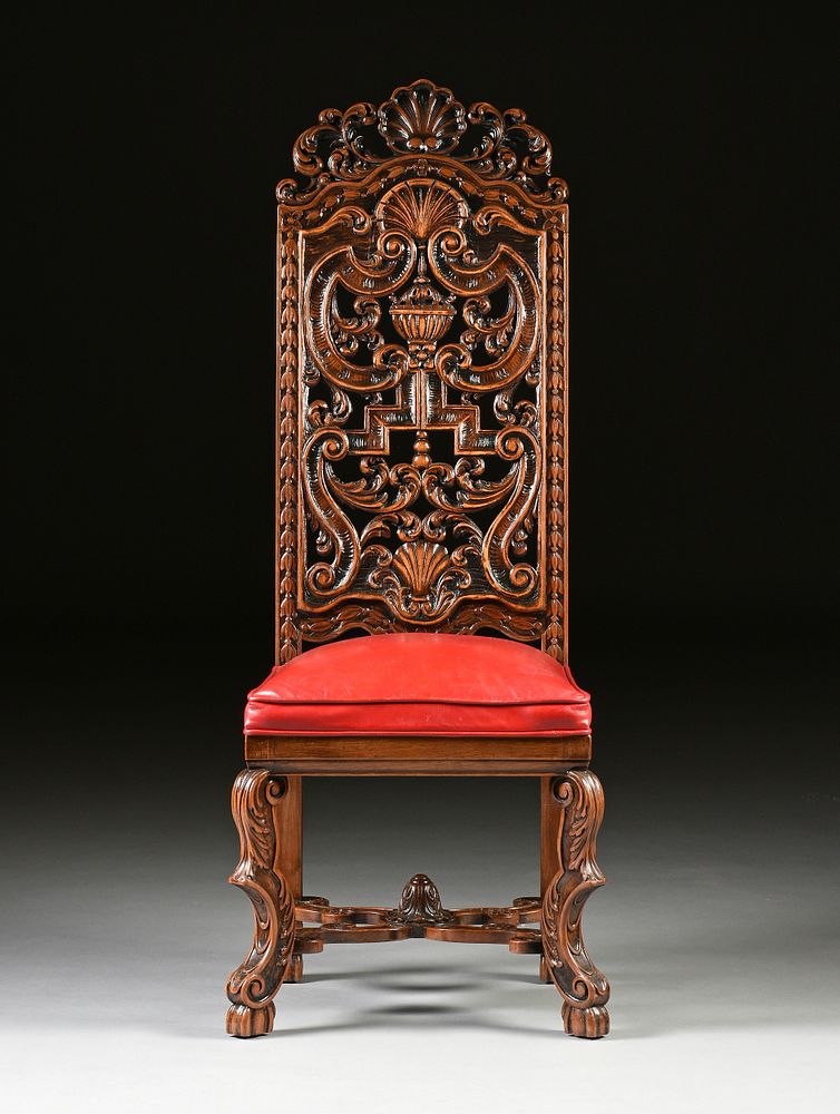 Appraisal: A CHARLES II STYLE CARVED WALNUT AND RED LEATHER UPHOLSTERED