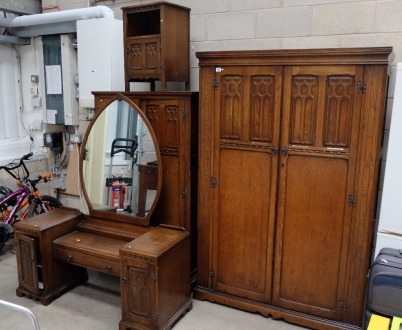 Appraisal: Oak carved linen fold bedroom suite comprising Double wardrobe tallboy