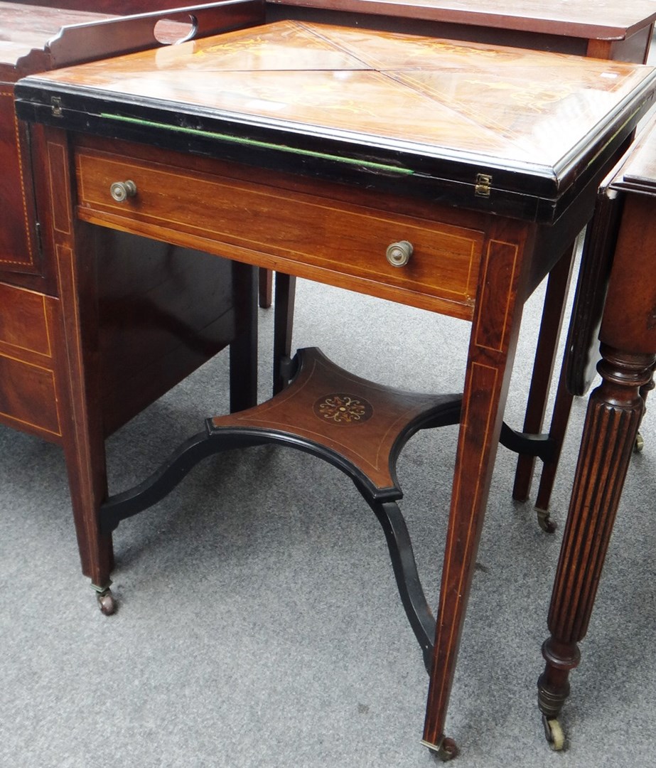 Appraisal: A late th century marquetry inlaid rosewood envelope card table