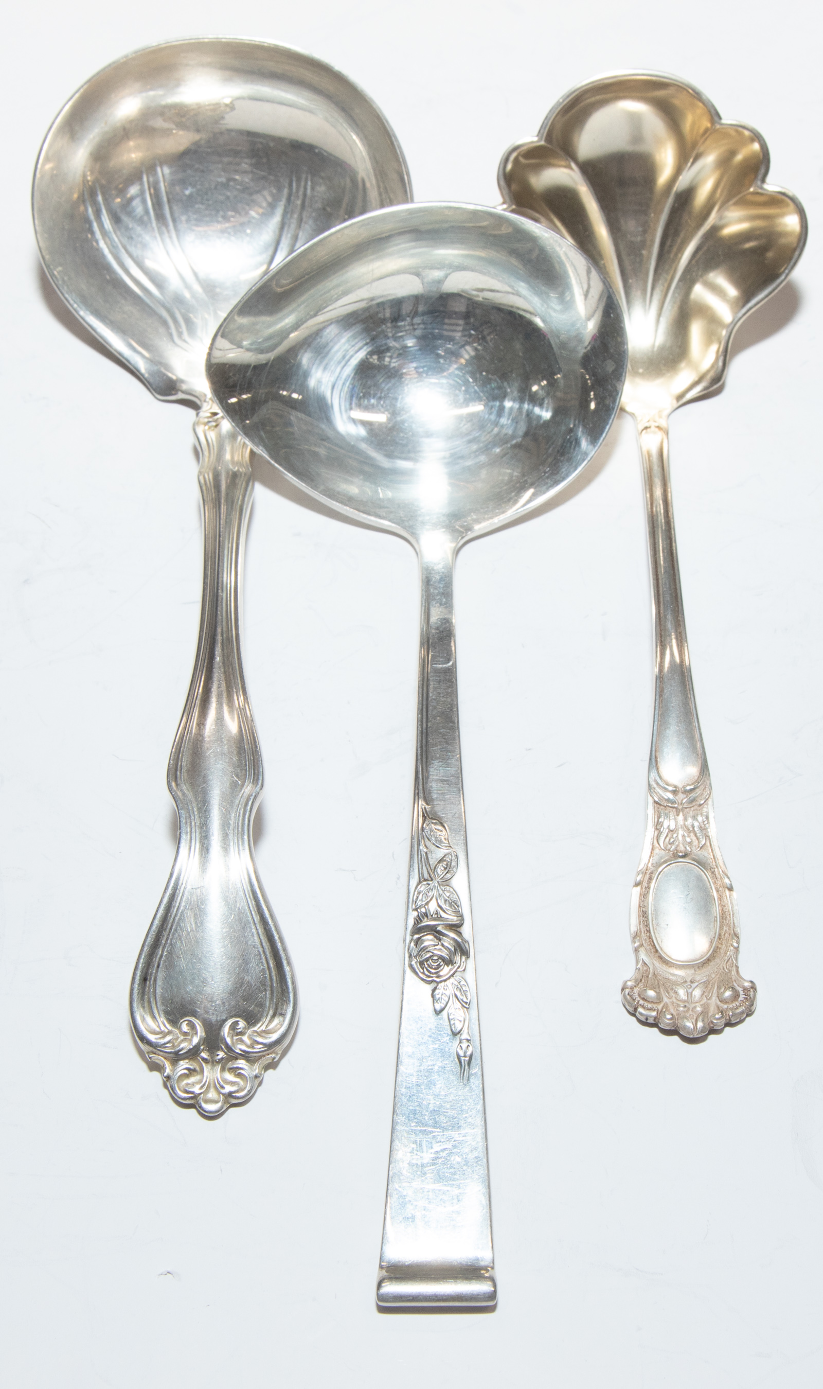 Appraisal: THREE STERLING SAUCE LADLES Including Reed Barton Classic Rose Westmorland