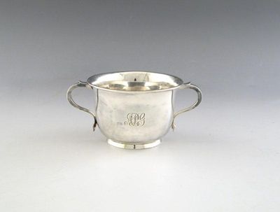 Appraisal: A silver two-handled bowl circular form scroll handles on a