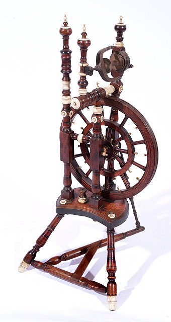 Appraisal: AN OLD WOODEN SPINNING WHEEL finely turned with bone mounts